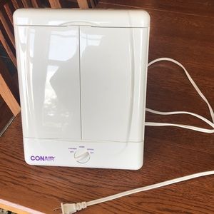 White Conair plug in light up mirror